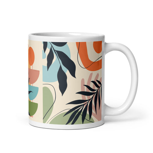 Cană ceramică cu design abstract botanic — frunze stilizate și forme organice în nuanțe de negru, portocaliu, albastru, verde și roz pe fundal crem.